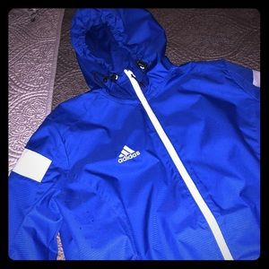 Blue Adidas windbreaker jacket.